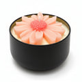 Flower-shaped sculptural candle in a black reusable container, natural wax, decorative home decor