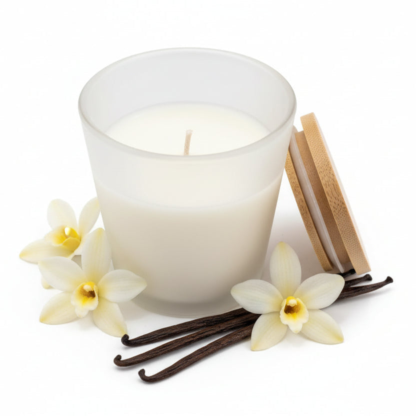 Natural wax vanilla-scented candle in frosted glass jar with vanilla beans and flowers