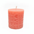 Pink sculptural candle with embossed love and heart pattern, natural wax home decor