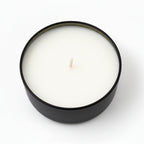 eucalyptus coconut scented candle in a black round container on white background