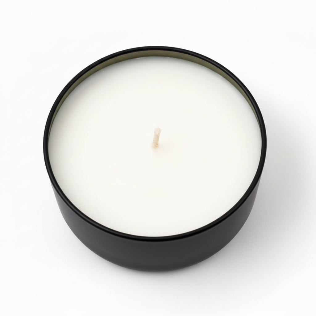 eucalyptus coconut scented candle in a black round container on white background
