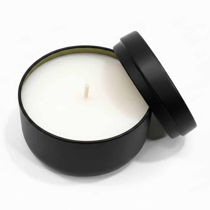 eucalyptus coconut wax candle in matte black reusable tin with lid, on white background